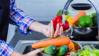 Somebody washing vegetables